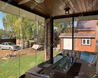 Веранда с раздвижным холодным панорамным остеклением