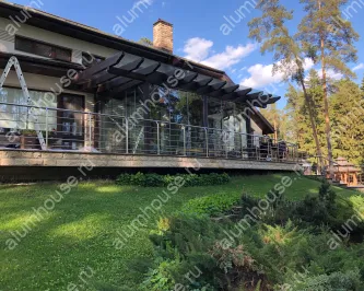 Стеклянная пристройка с безрамным остеклением и стеклянной крышей