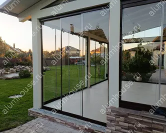 Остекление террасы от пола до потолка раздвижной слайд конструкцией