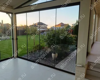 Остекление террасы от пола до потолка раздвижной слайд конструкцией