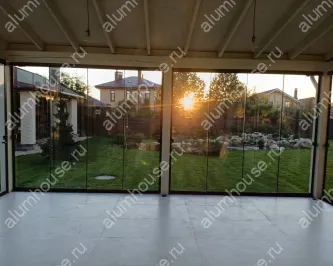 Остекление террасы от пола до потолка раздвижной слайд конструкцией