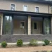 Превью - Остекление веранды раздвижными панорамными дверьми от пола до потолка
