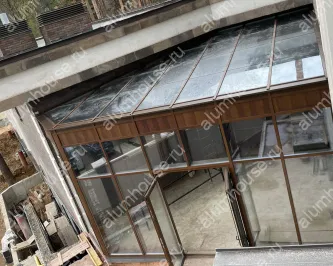 Зимний сад из алюминия с декорацией профиля под фактуру дерева