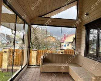 Алюминиевое раздвижное безрамное остекление веранды