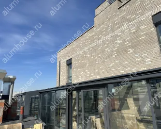 Зимний сад из алюминиевого профиля на крыше дома