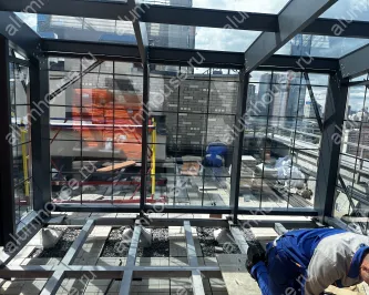 Зимний сад из алюминиевого профиля на крыше дома