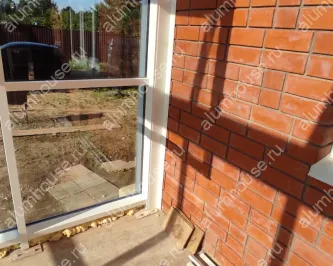 Зимний сад из алюминия пристроенный к углу дома