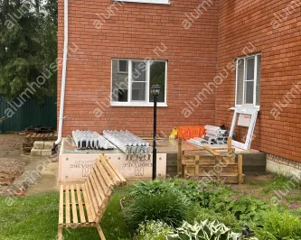 Зимний сад из алюминия пристроенный к углу дома