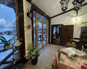 Остекление веранды алюминиевой входной группой и складными окнами гармошка